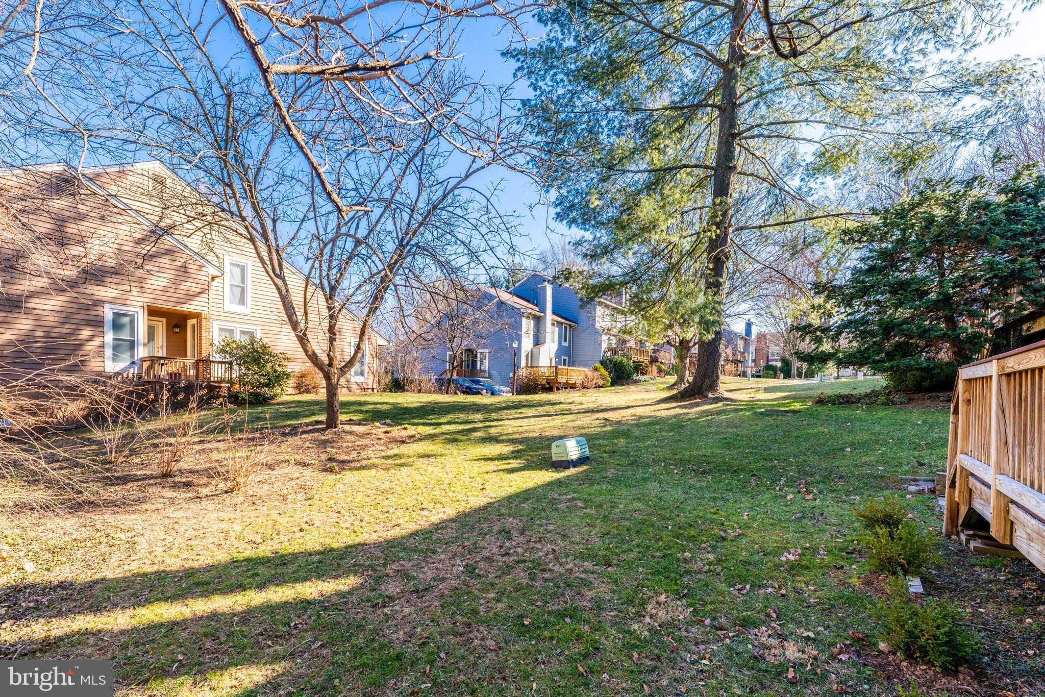 1609 Apricot Court Reston, VA 20190 - Photo 54 of 56 a view of yard with swimming pool and large trees