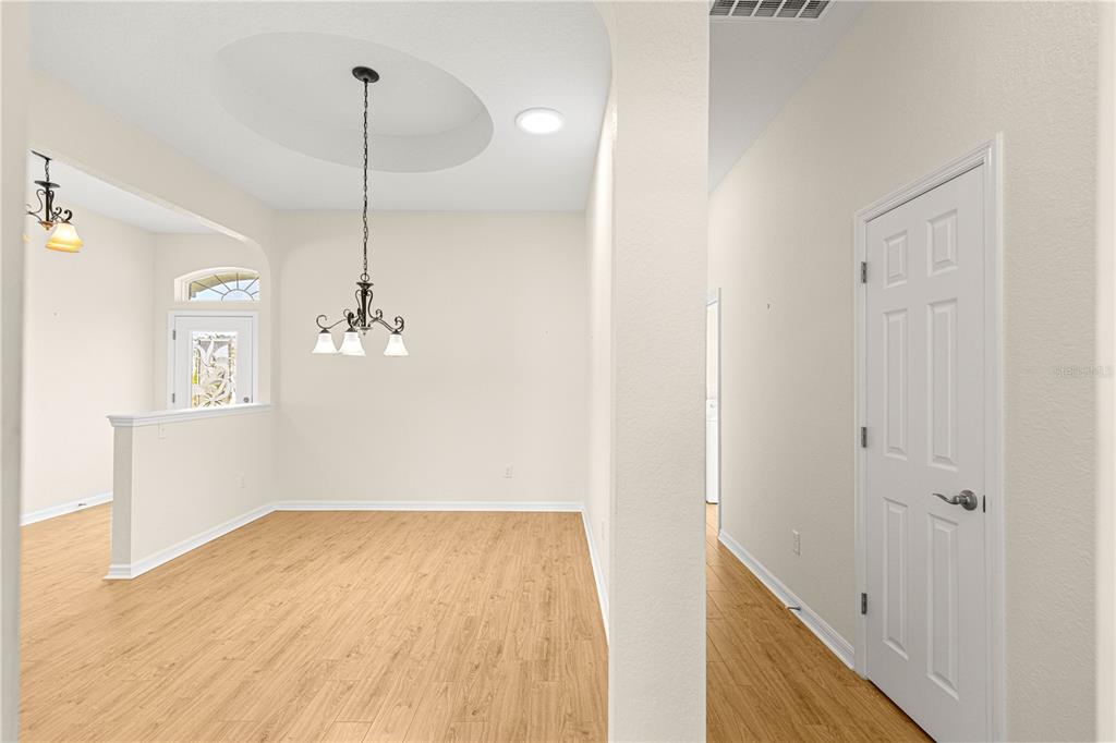 17306 Southeast 112th Court Road Summerfield, FL 34491 - Photo 14 of 42 a view of empty room with wooden floor