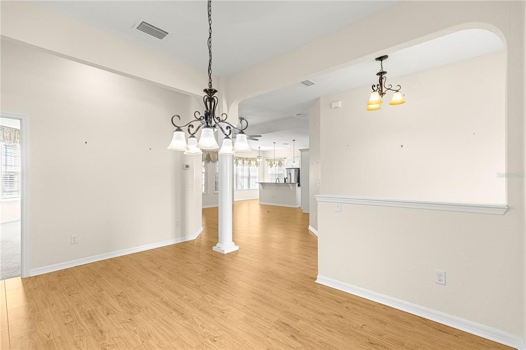 17306 Southeast 112th Court Road Summerfield, FL 34491 - Photo 17 of 42 a view of a chandelier in an empty room