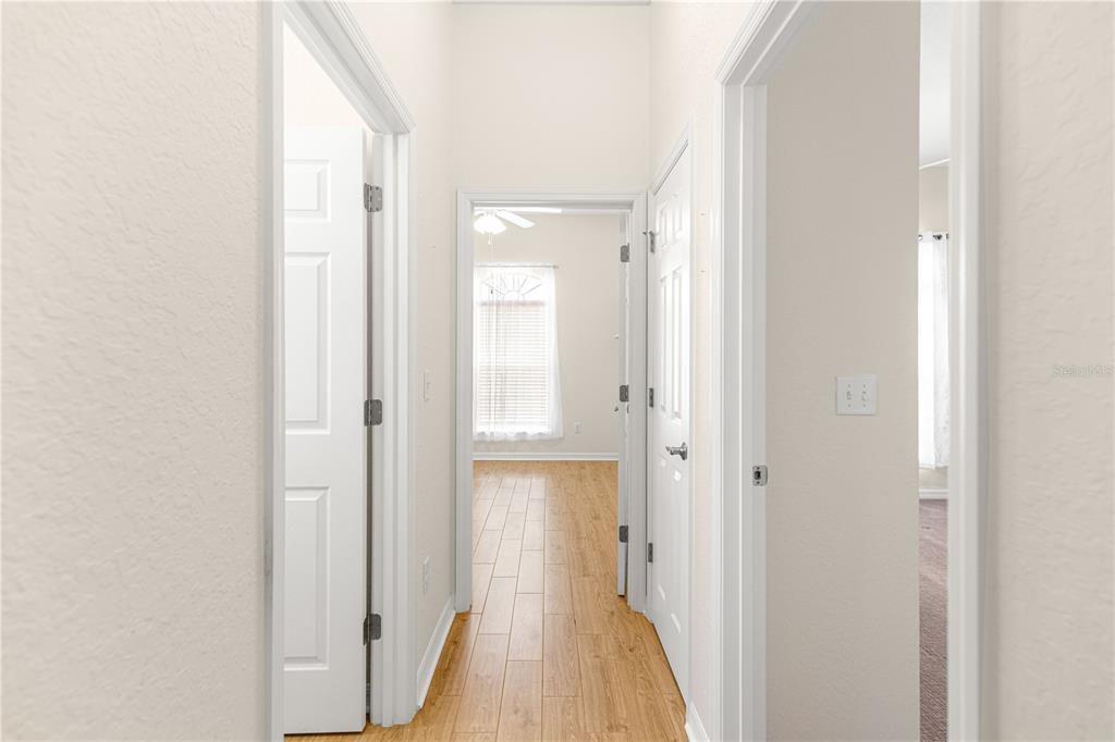 17306 Southeast 112th Court Road Summerfield, FL 34491 - Photo 21 of 42 a view of a bathroom from a hallway