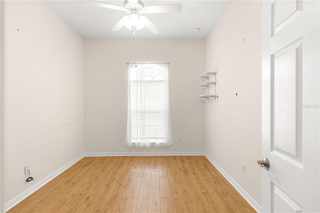 17306 Southeast 112th Court Road Summerfield, FL 34491 - Photo 27 of 42 wooden floor in an empty room with a window