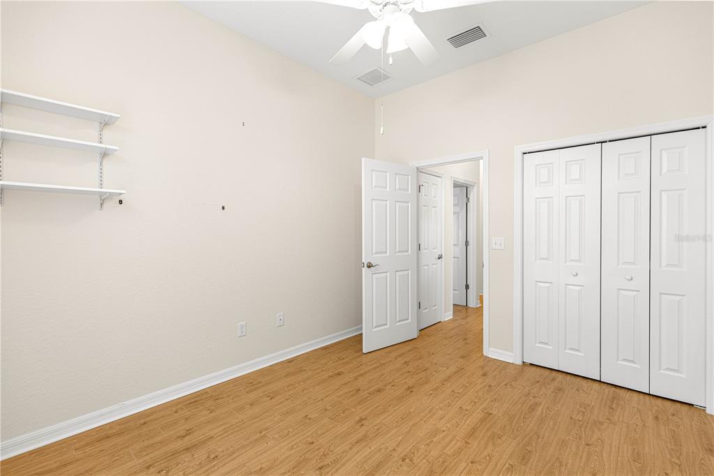 17306 Southeast 112th Court Road Summerfield, FL 34491 - Photo 28 of 42 wooden floor in an empty room
