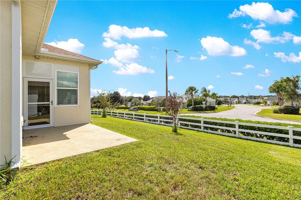 17306 Southeast 112th Court Road Summerfield, FL 34491 - Photo 38 of 42 a view of a swimming pool with an outdoor seating