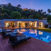 swimming pool view with a seating space