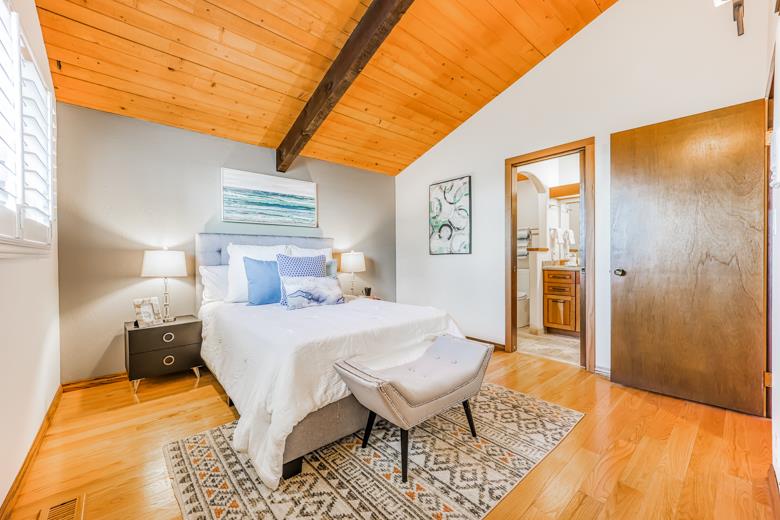 11 Senior Avenue Berkeley, CA 94708 - Photo 11 of 38 a bedroom with a bed rug and wooden floor