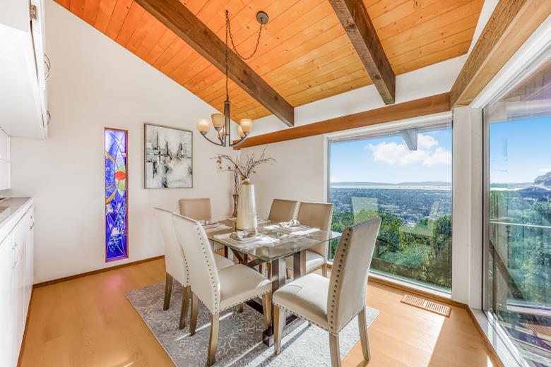 11 Senior Avenue Berkeley, CA 94708 - Photo 2 of 38 a view of a dining room with furniture window and outside view