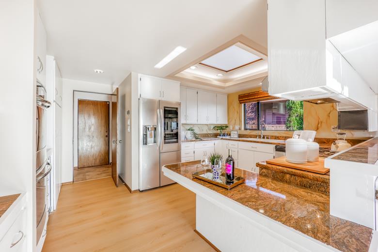 11 Senior Avenue Berkeley, CA 94708 - Photo 9 of 38 a living room with stainless steel appliances kitchen island granite countertop furniture and a view of kitchen