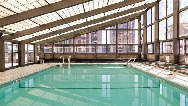 a view of a swimming pool with a lounge chairs