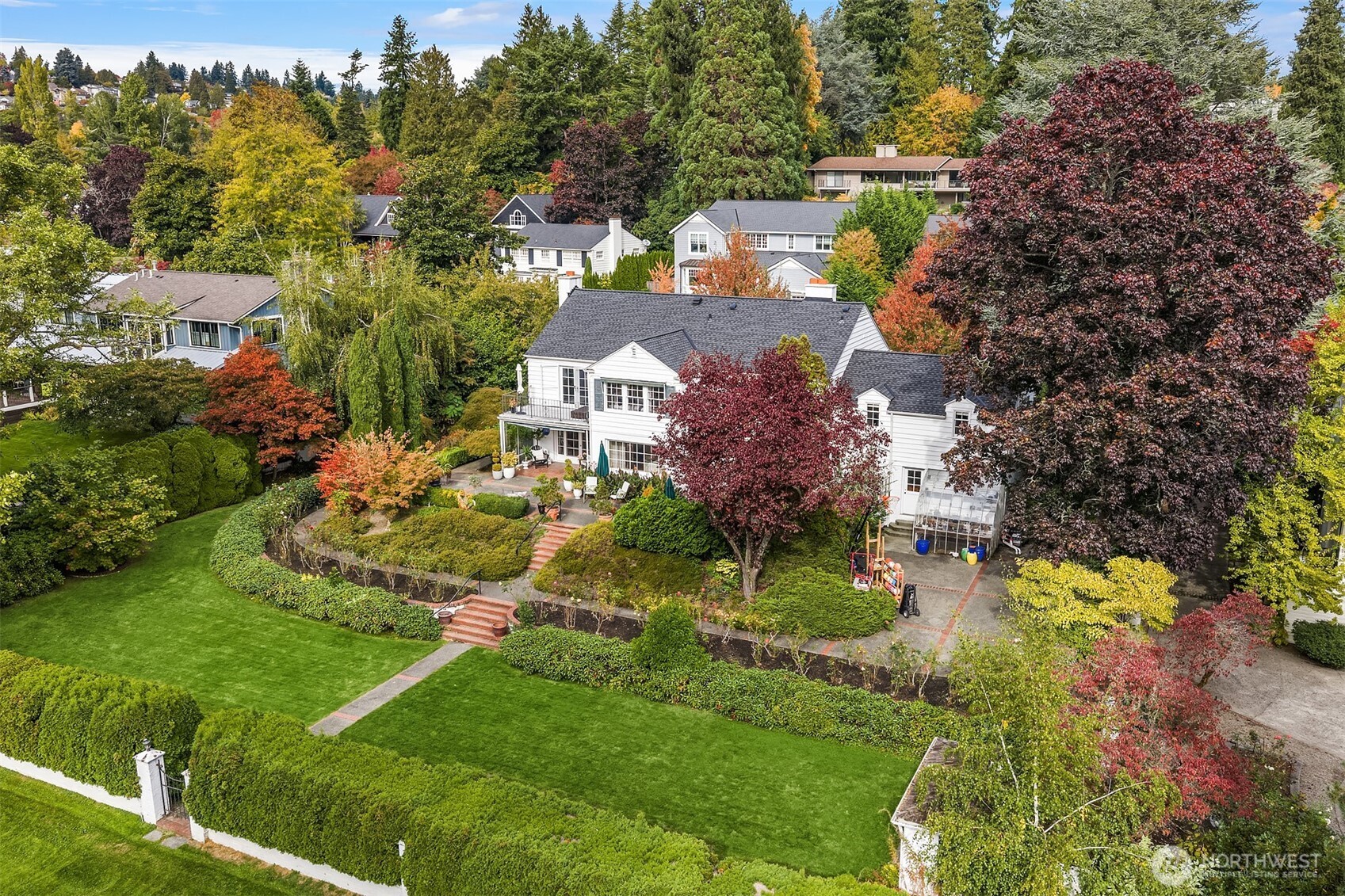 5525 Northeast Penrith Road Seattle, WA 98105 - Photo 2 of 36 an aerial view of residential houses with outdoor space and trees