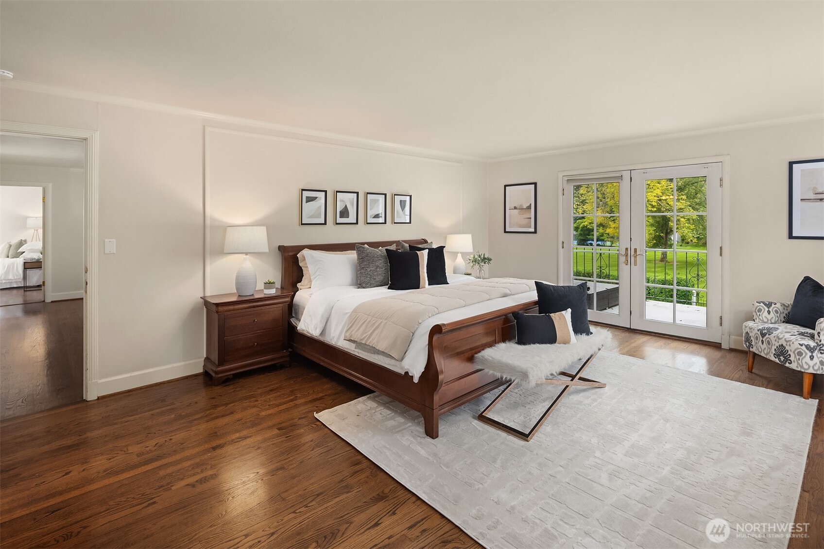 5525 Northeast Penrith Road Seattle, WA 98105 - Photo 26 of 36 a bedroom with a bed couch and a large window