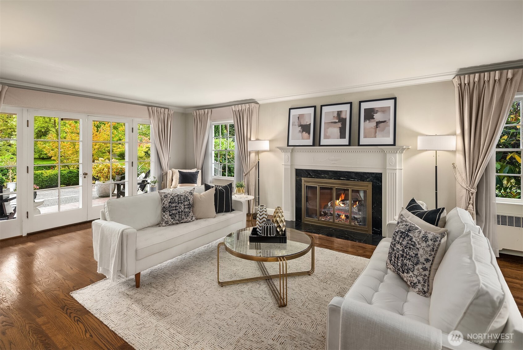 5525 Northeast Penrith Road Seattle, WA 98105 - Photo 8 of 36 a living room with furniture and a fireplace