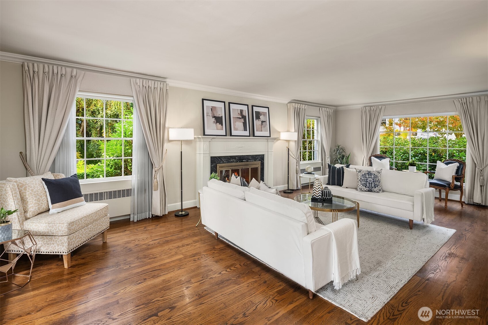 5525 Northeast Penrith Road Seattle, WA 98105 - Photo 9 of 36 a living room with furniture and a fireplace