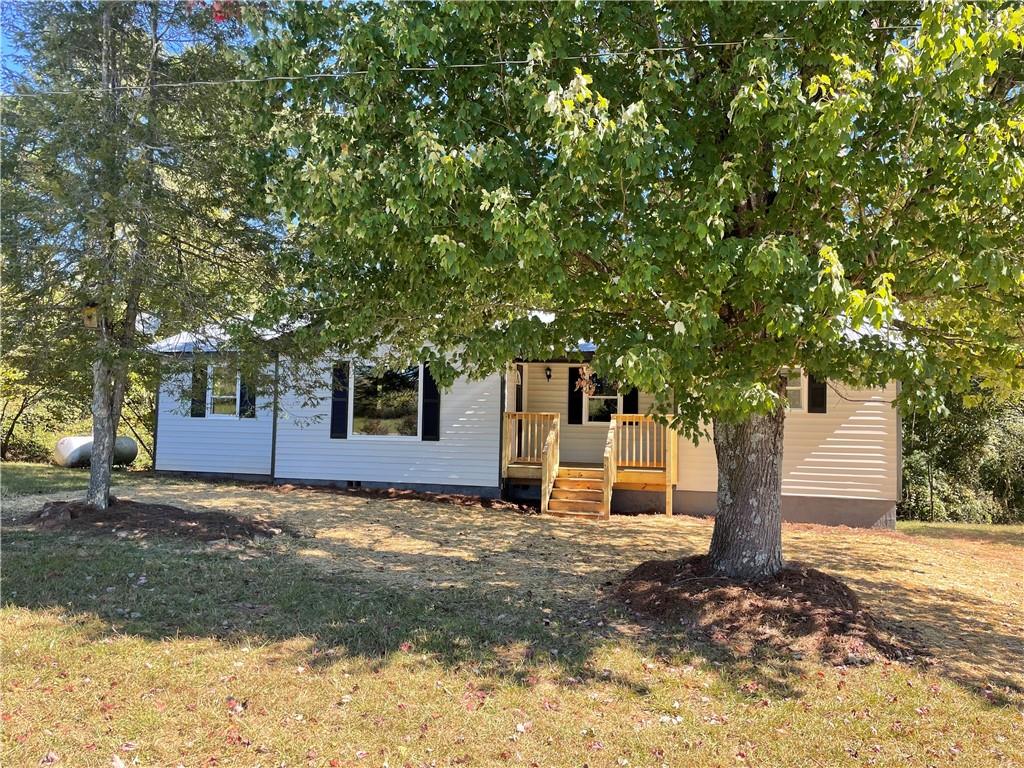 1638 Moccasin Gap Road Lula, GA 30554 - Photo 1 of 1 a view of a house with a tree tree