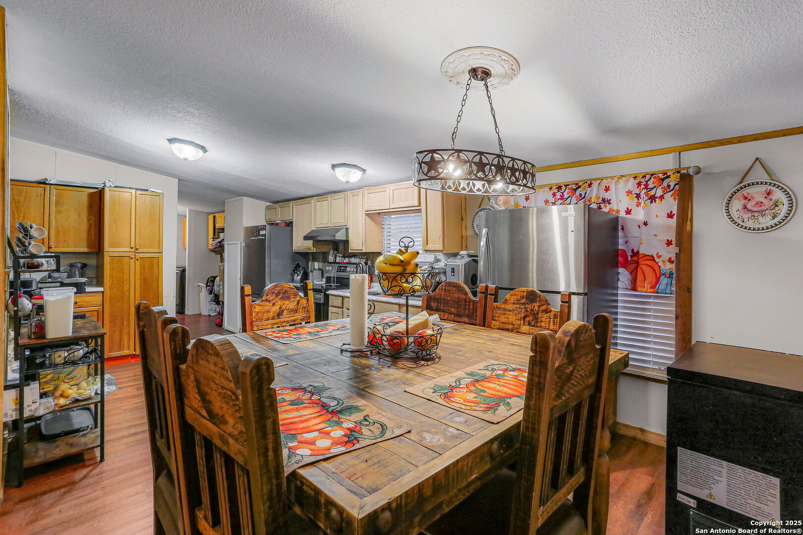 12925 Luckey Road Atascosa, TX 78002 - Photo 15 of 50 a view of a dining room with furniture window and wooden floor
