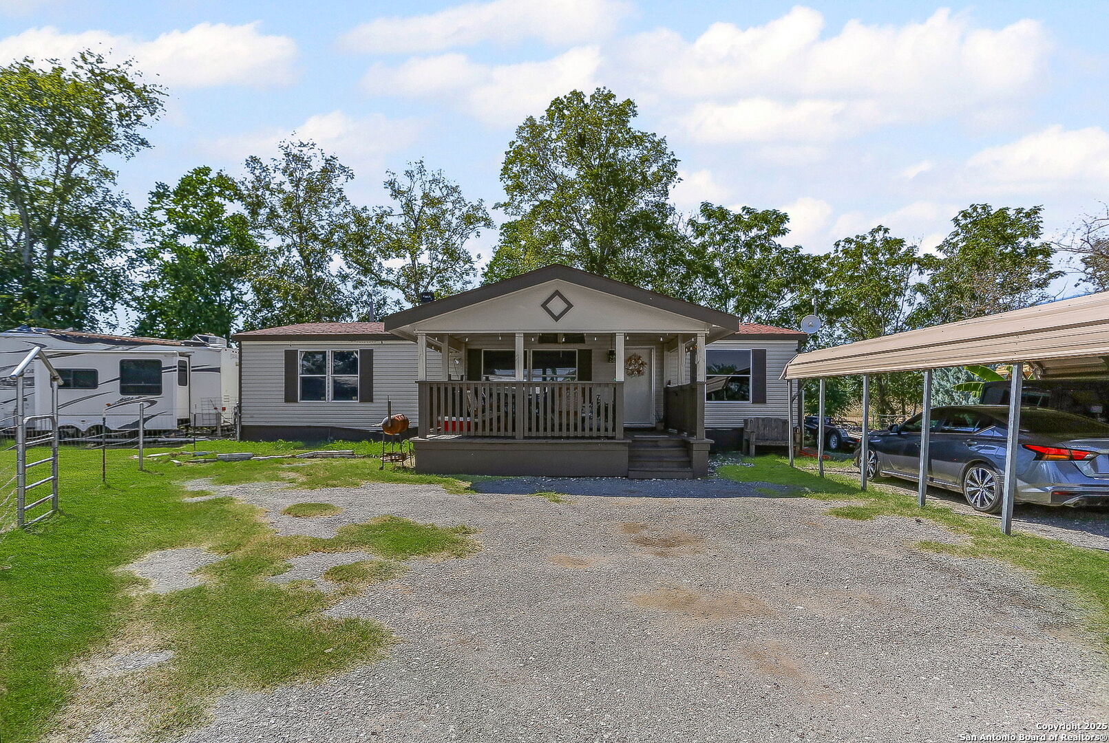 12925 Luckey Road Atascosa, TX 78002 - Photo 2 of 50 a front view of a house with garden
