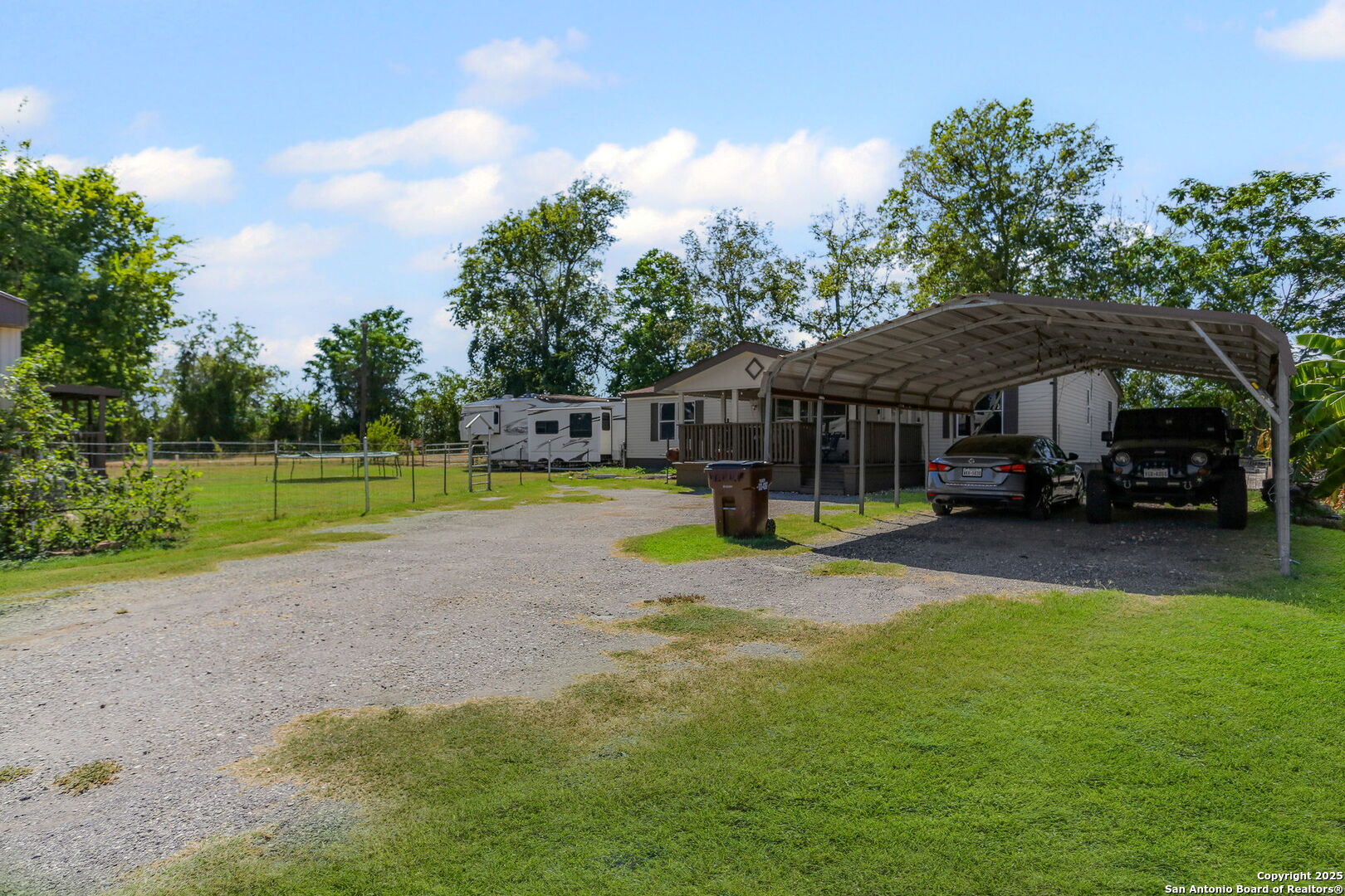 12925 Luckey Road Atascosa, TX 78002 - Photo 3 of 50 a view of a house with swimming pool and sitting area