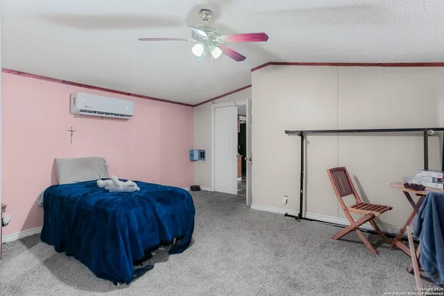 a bedroom with a bed and a chair