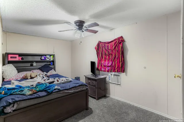 a bedroom with a bed and a walk in closet