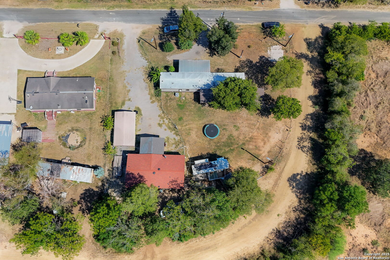12925 Luckey Road Atascosa, TX 78002 - Photo 41 of 50 an aerial view of a house with a swimming pool