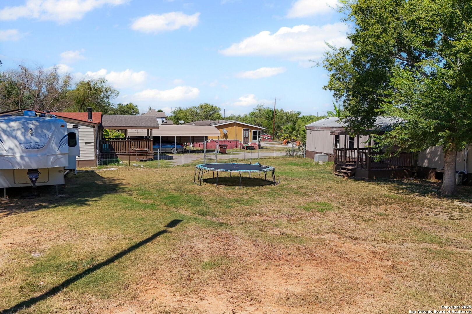 12925 Luckey Road Atascosa, TX 78002 - Photo 47 of 50 a view of a house with swimming pool and sitting area