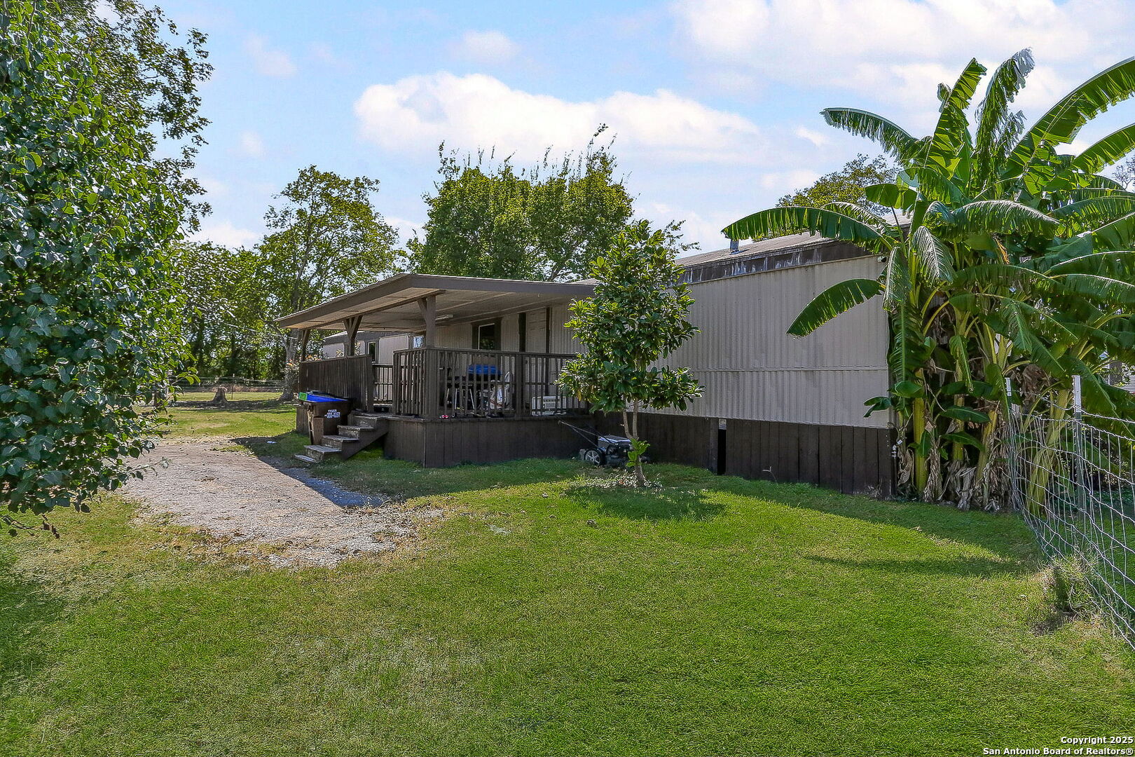 12925 Luckey Road Atascosa, TX 78002 - Photo 7 of 50 a view of a house with a yard and sitting area