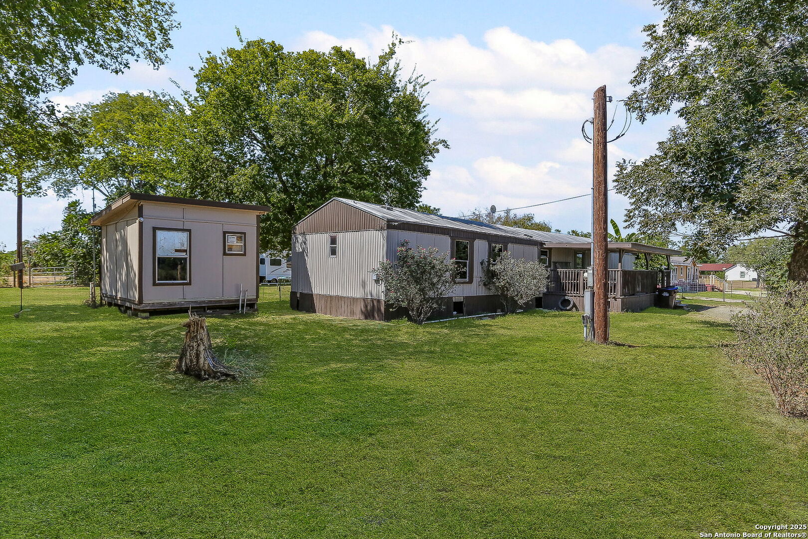 12925 Luckey Road Atascosa, TX 78002 - Photo 8 of 50 a front view of a house with a yard