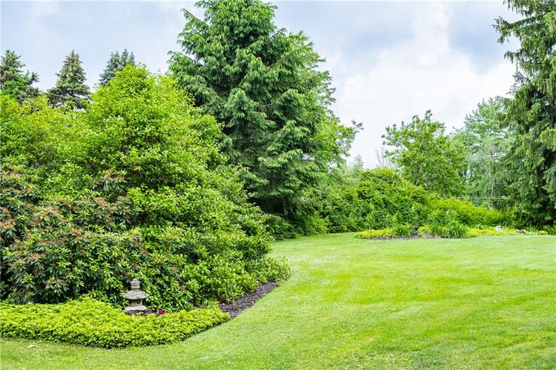 3666 Sandy Hill Road Gibsonia, PA 15044 - Photo 5 of 23 The level back yard is quiet and serene or a great place for a volleyball net and a party!