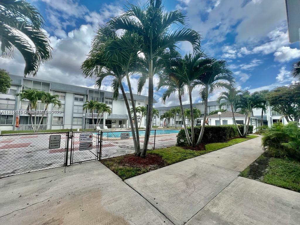 6705 Northwest 169th Street, Unit C205 Hialeah, FL 33015 - Photo 13 of 13 a view of a park with swings and slides