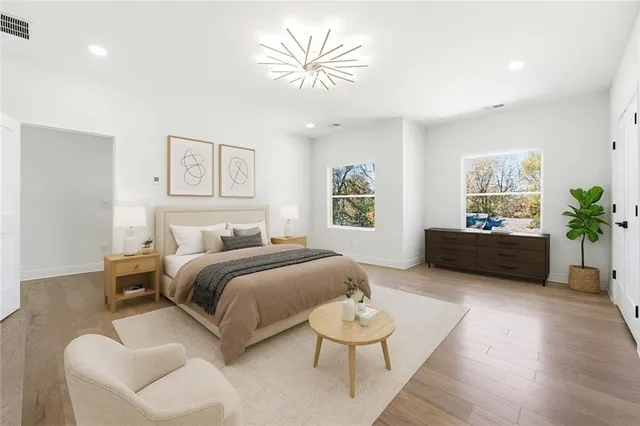 a bathroom with a shower mirror and a sink
