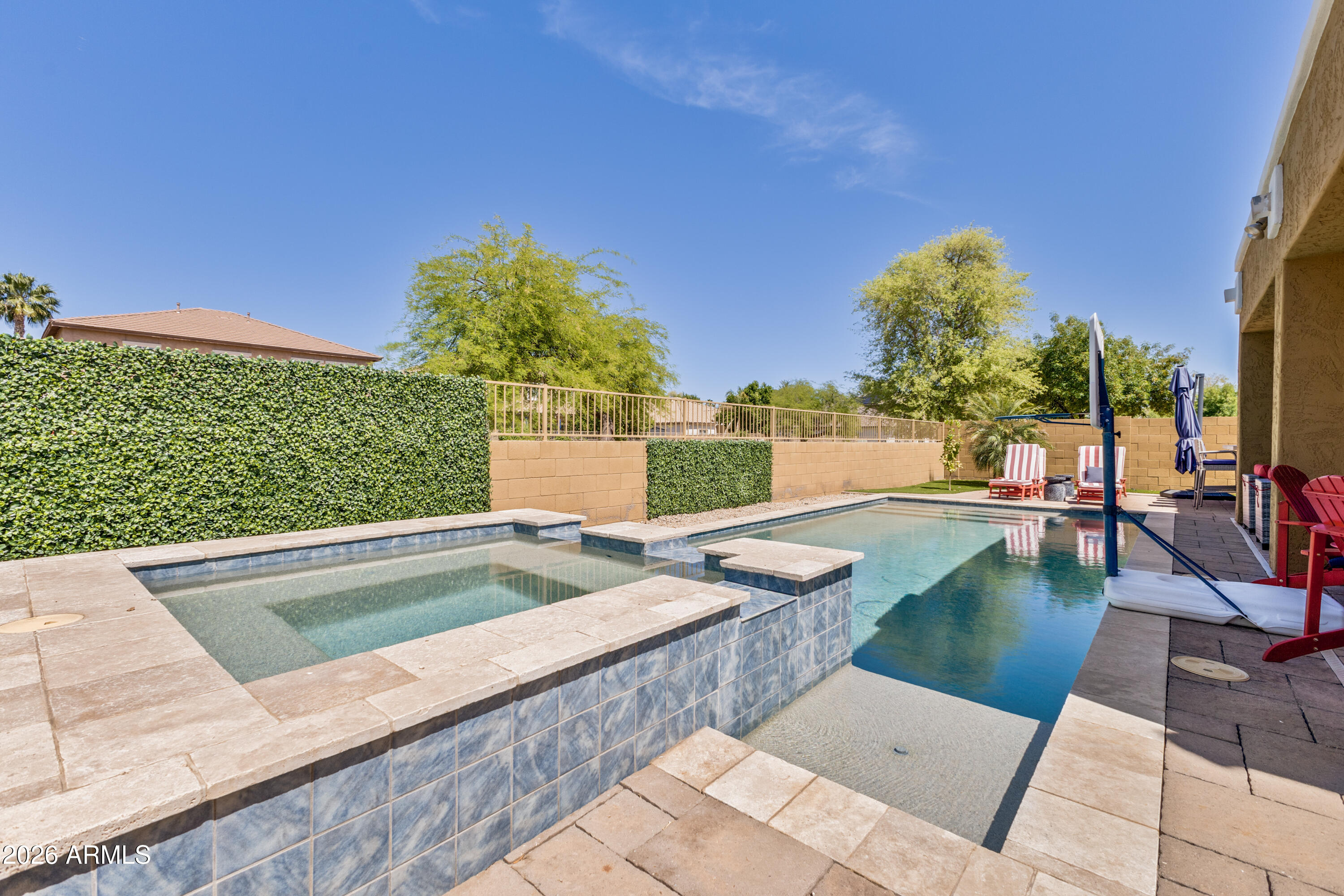 3256 East Geronimo Court Gilbert, AZ 85295 - Photo 13 of 53 a view of a swimming pool with a lounge chairs