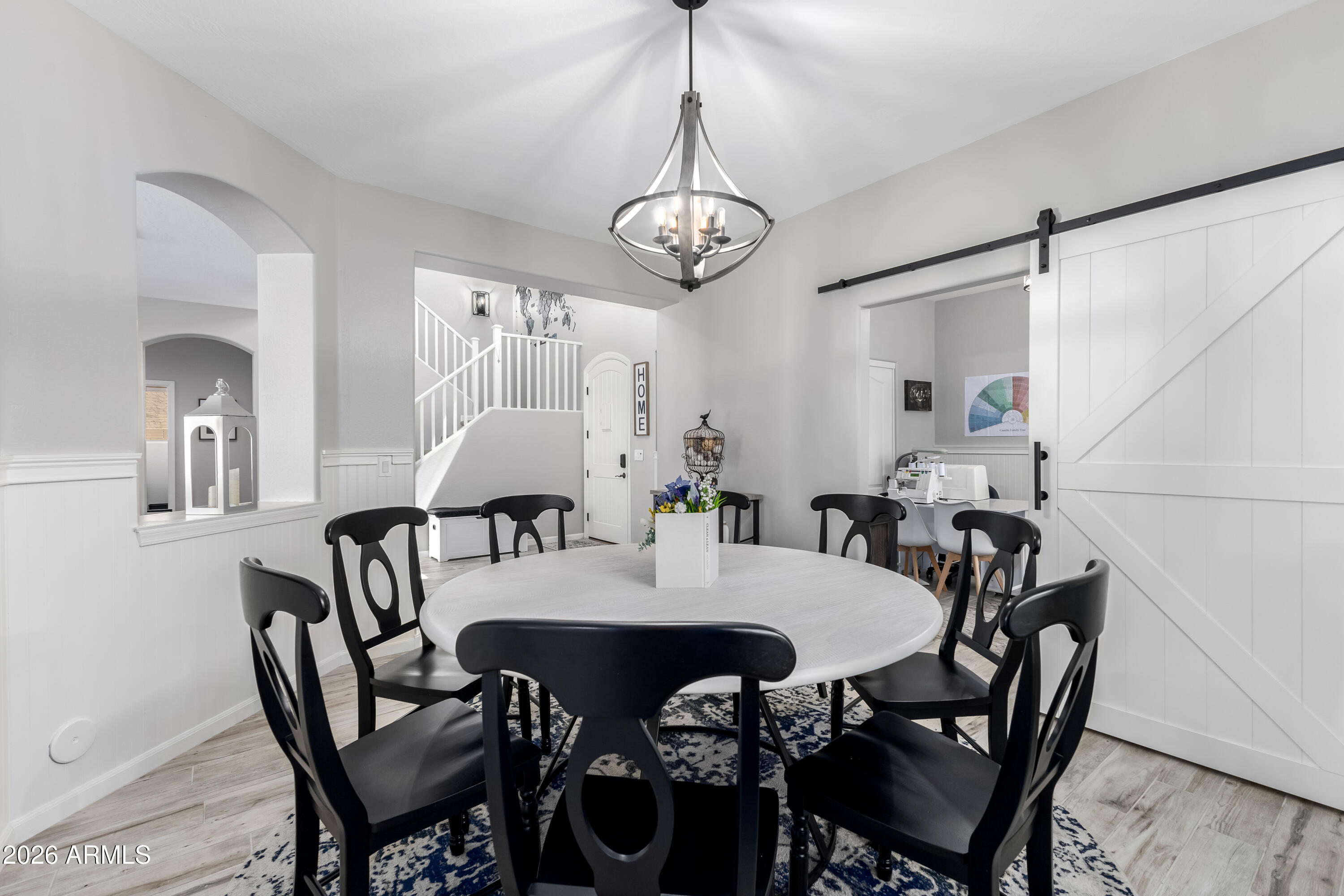 3256 East Geronimo Court Gilbert, AZ 85295 - Photo 18 of 53 a view of a dining room with furniture and wooden floor