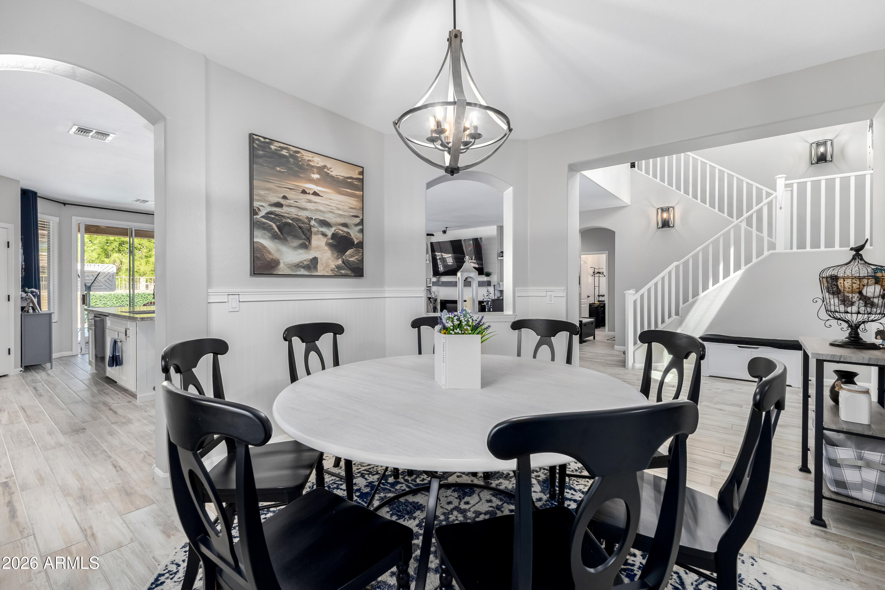 3256 East Geronimo Court Gilbert, AZ 85295 - Photo 19 of 53 a view of a dining room with furniture and chandelier