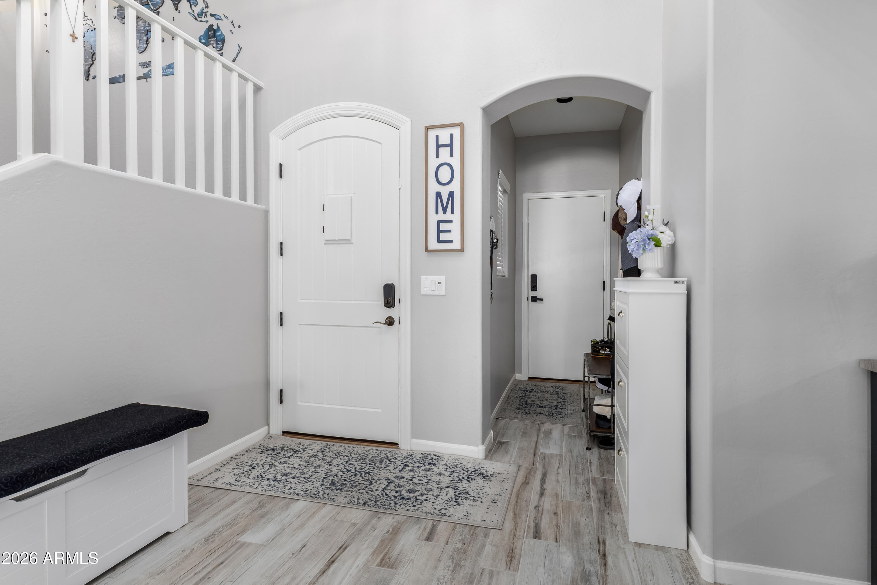 3256 East Geronimo Court Gilbert, AZ 85295 - Photo 20 of 53 a view of a hallway with wooden floor and a bathroom