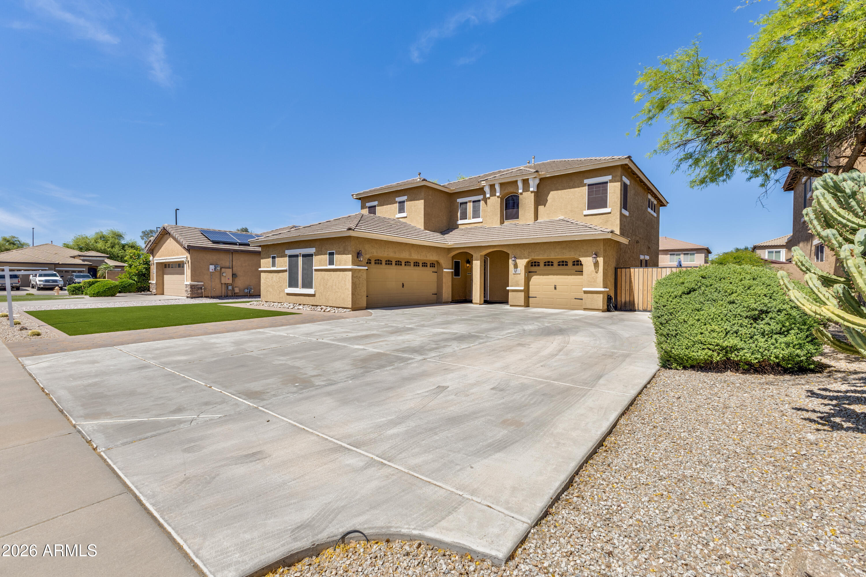 3256 East Geronimo Court Gilbert, AZ 85295 - Photo 2 of 53 a front view of a house with a garden and yard