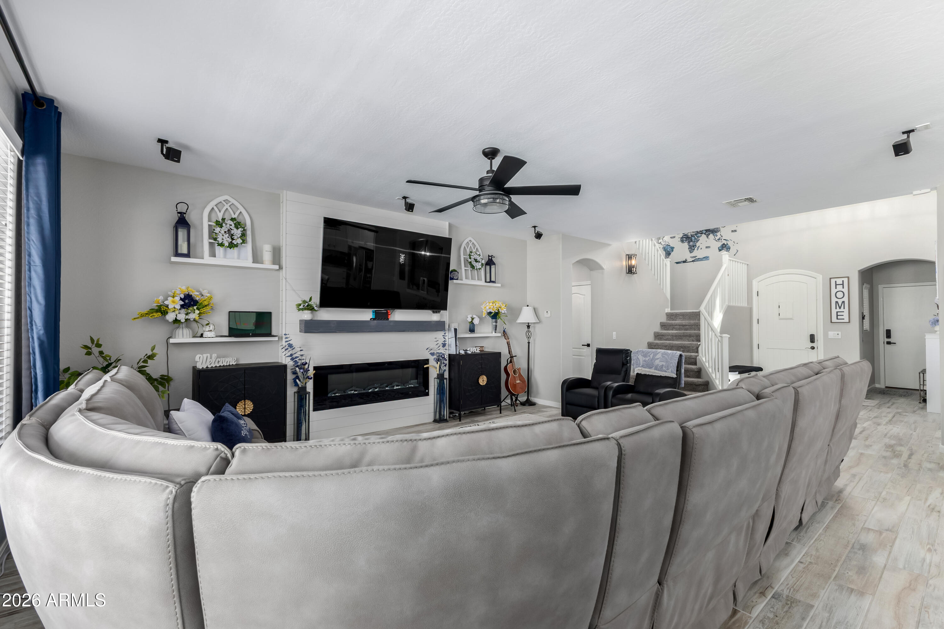 3256 East Geronimo Court Gilbert, AZ 85295 - Photo 23 of 53 a living room with furniture and a flat screen tv