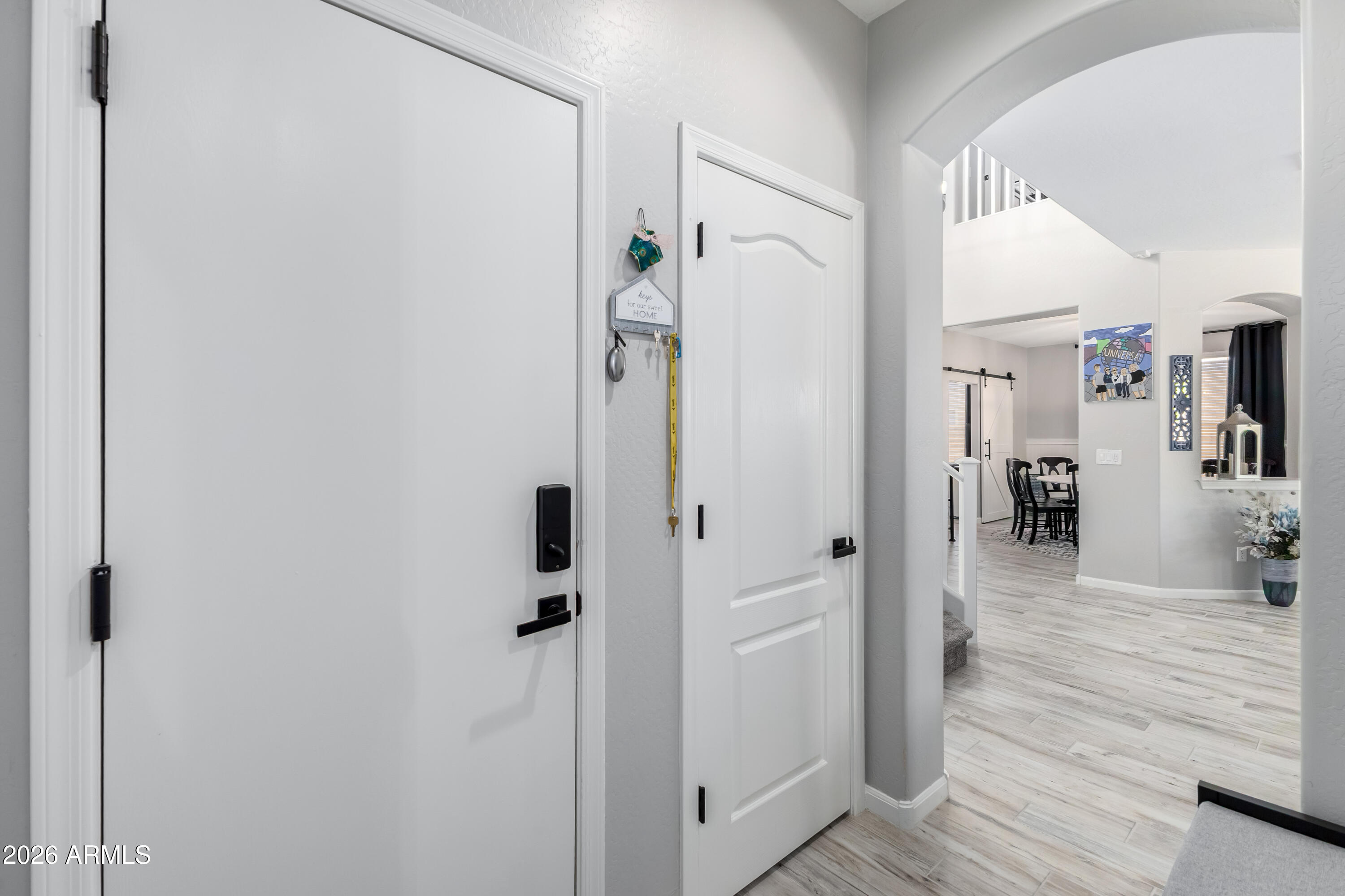 3256 East Geronimo Court Gilbert, AZ 85295 - Photo 32 of 53 a view of a hallway with wooden floor and entryway