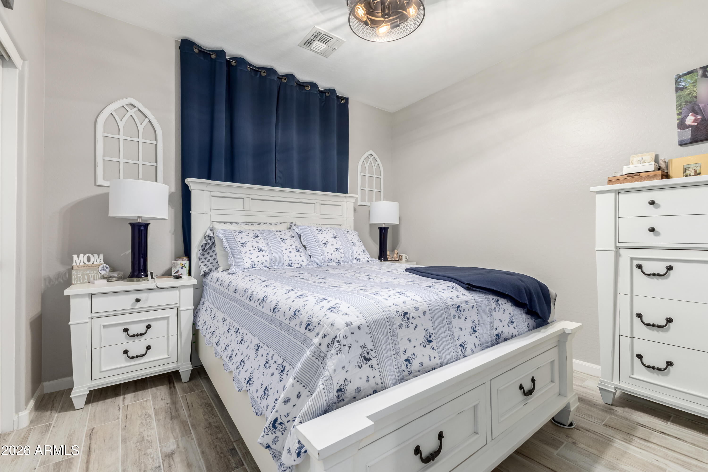 3256 East Geronimo Court Gilbert, AZ 85295 - Photo 35 of 53 a bedroom with a bed and a dresser