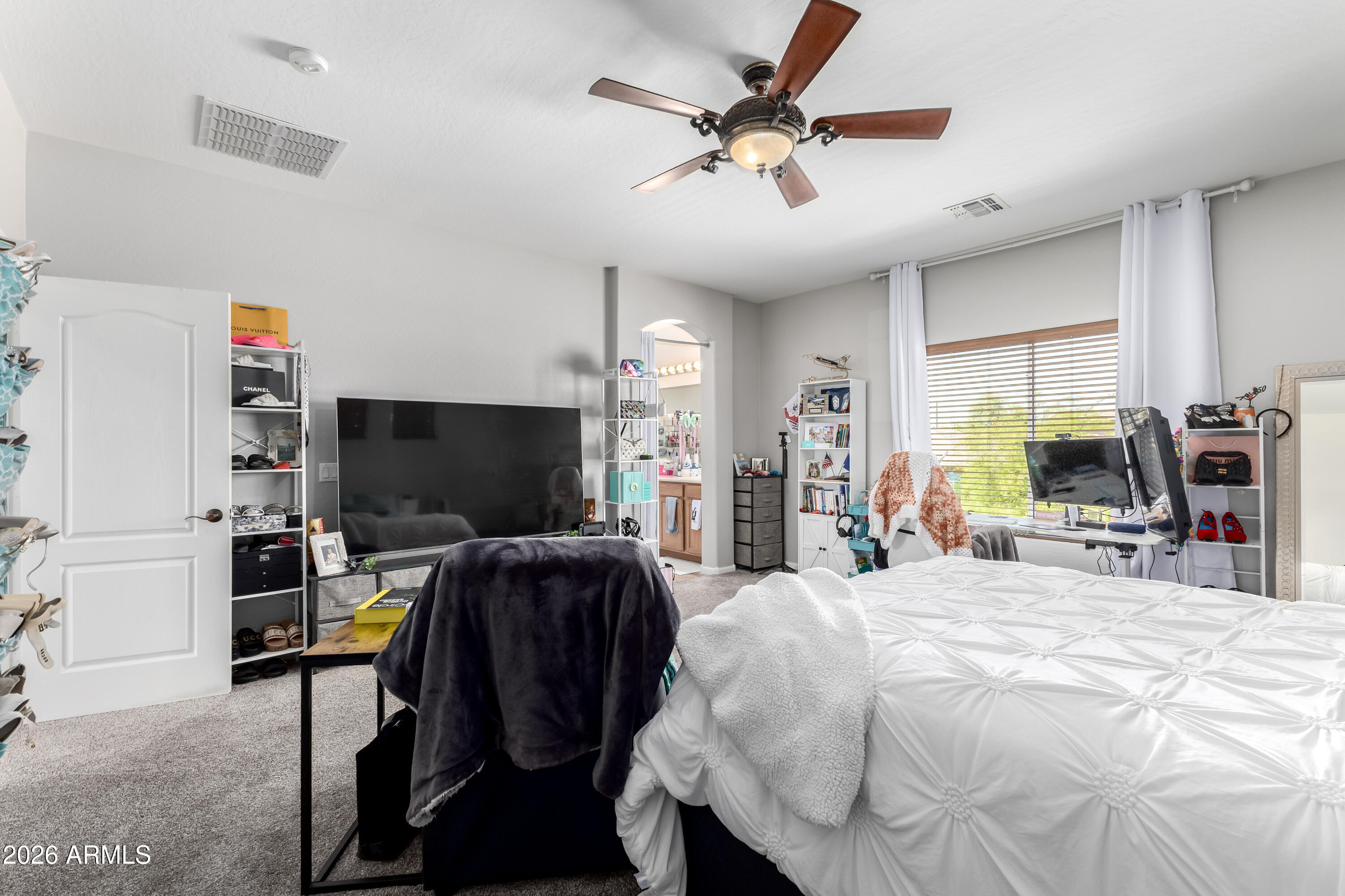 3256 East Geronimo Court Gilbert, AZ 85295 - Photo 40 of 53 a bedroom with a bed and a flat screen tv