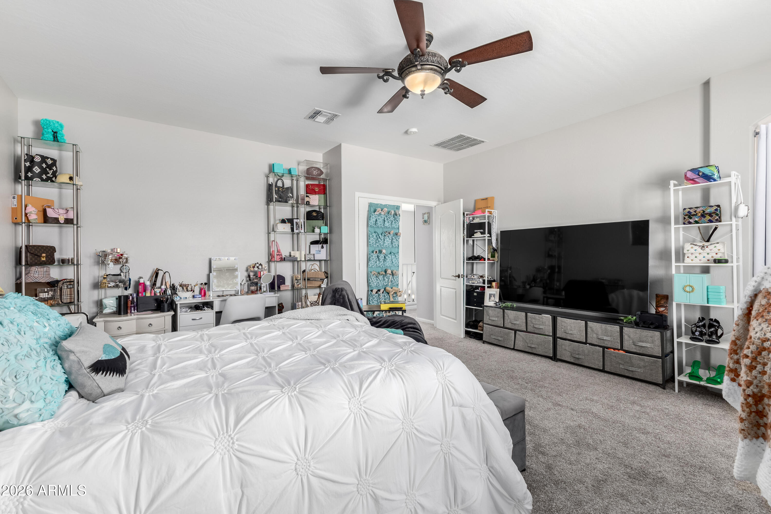 3256 East Geronimo Court Gilbert, AZ 85295 - Photo 41 of 53 a bedroom with a bed and a flat screen tv