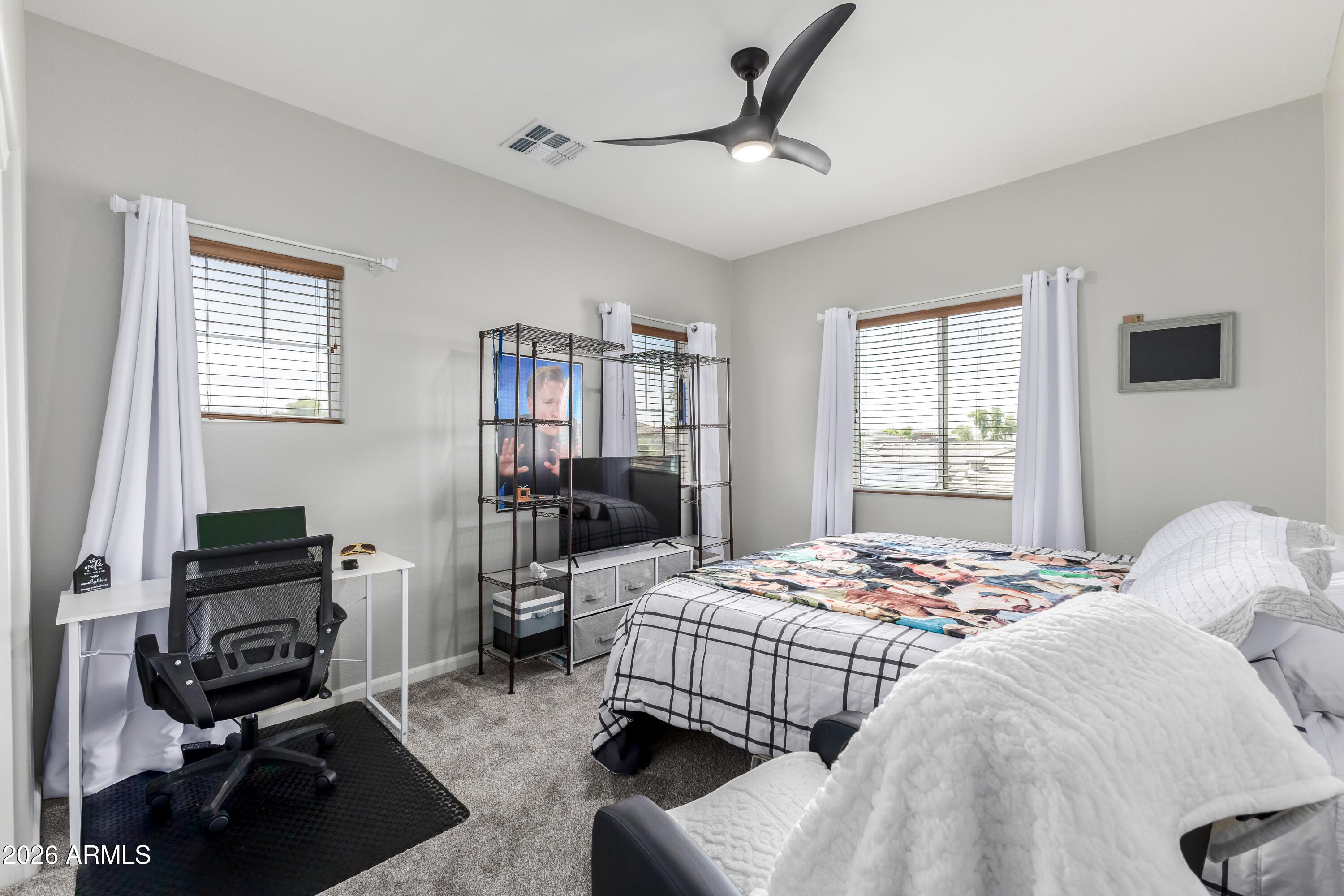 3256 East Geronimo Court Gilbert, AZ 85295 - Photo 47 of 53 a bedroom that has a bed and a chair