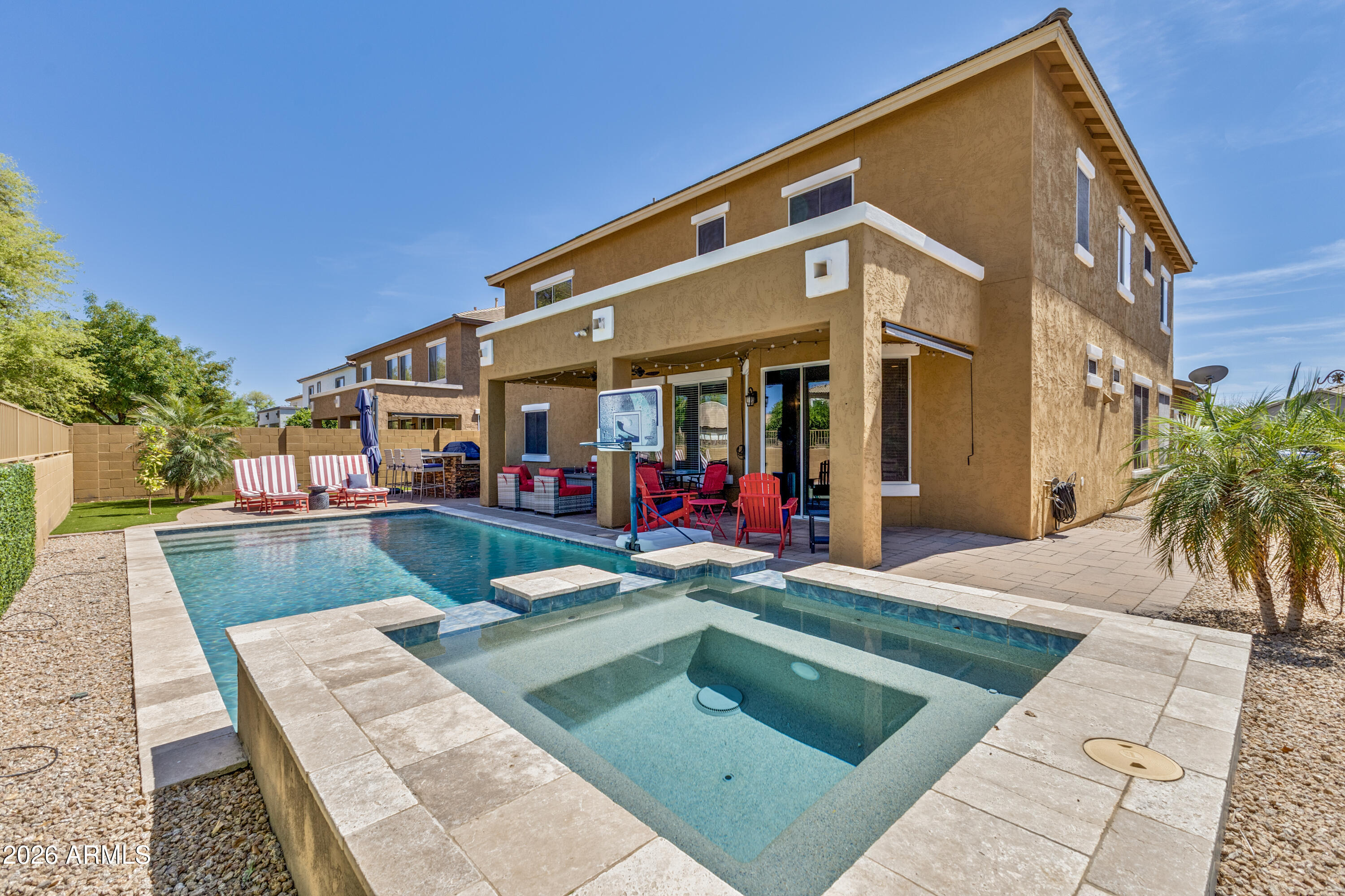 3256 East Geronimo Court Gilbert, AZ 85295 - Photo 5 of 53 a view of a white building with a yard