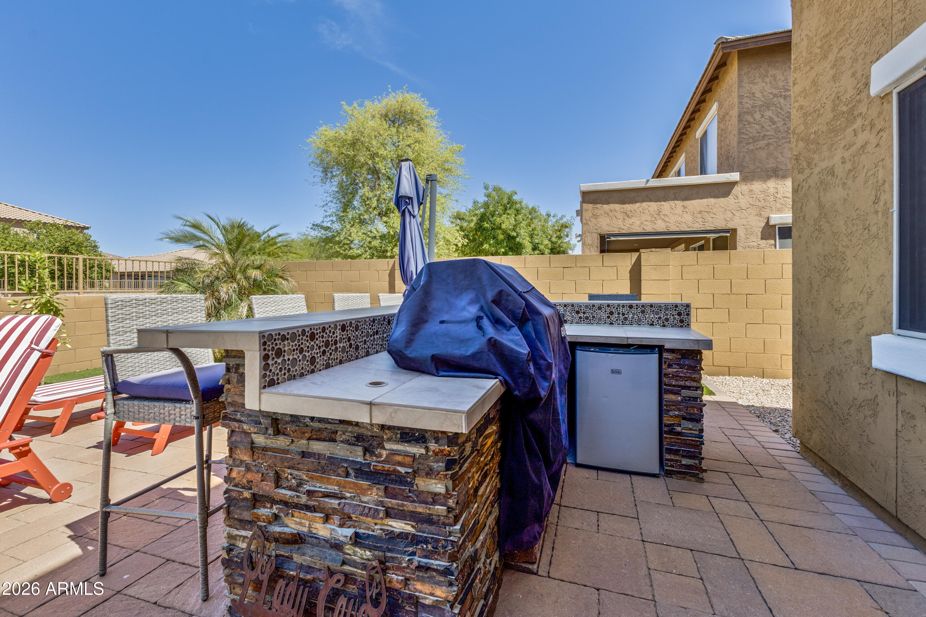 3256 East Geronimo Court Gilbert, AZ 85295 - Photo 7 of 53 a roof deck with table and chairs