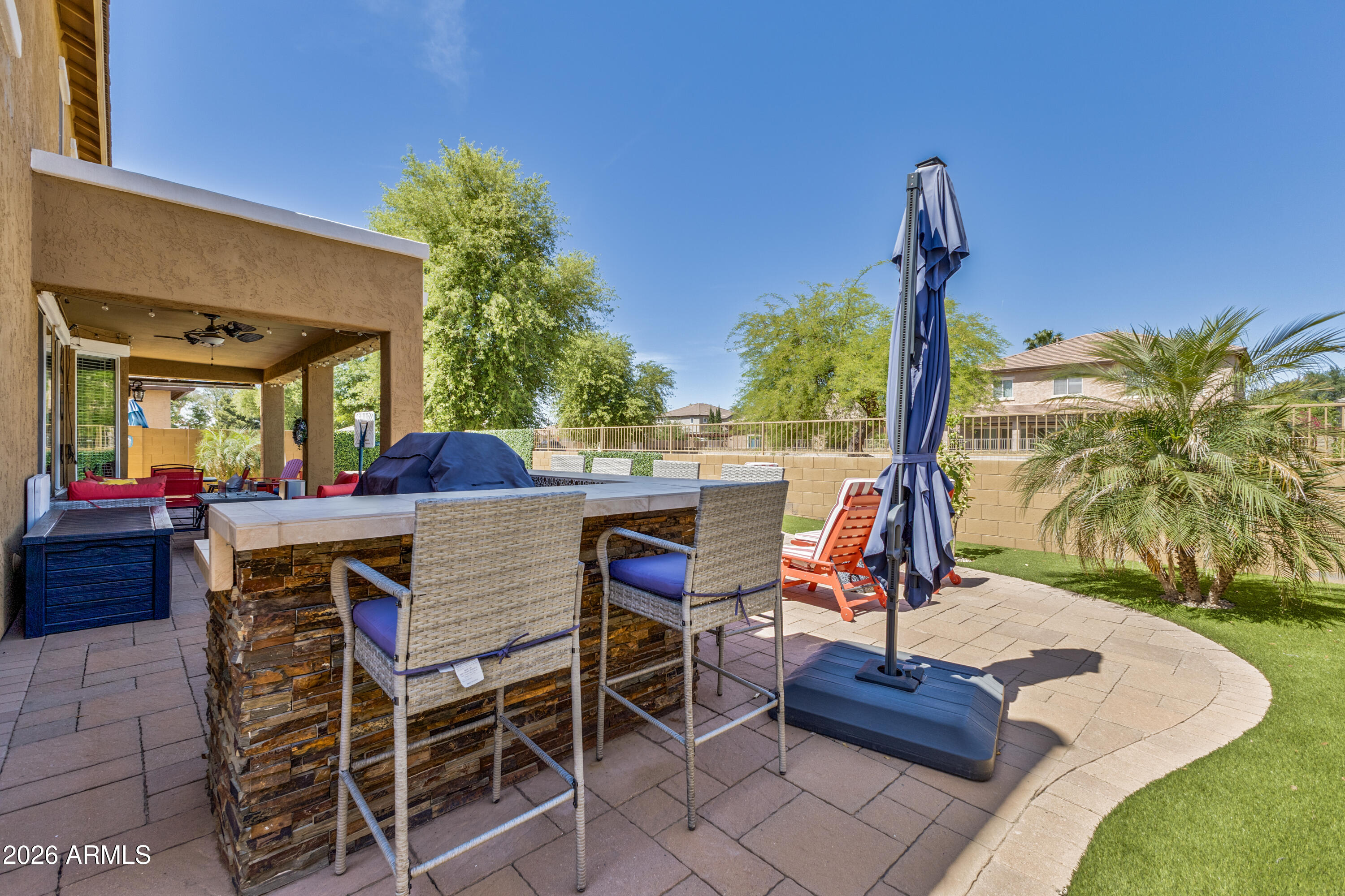 3256 East Geronimo Court Gilbert, AZ 85295 - Photo 9 of 53 a view of a chairs and table in the patio