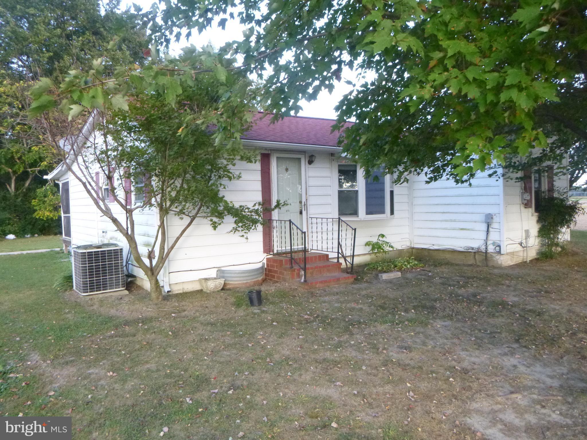 4669 Gadow Road Preston, MD 21655 - Photo 1 of 7 a front view of a house with a yard
