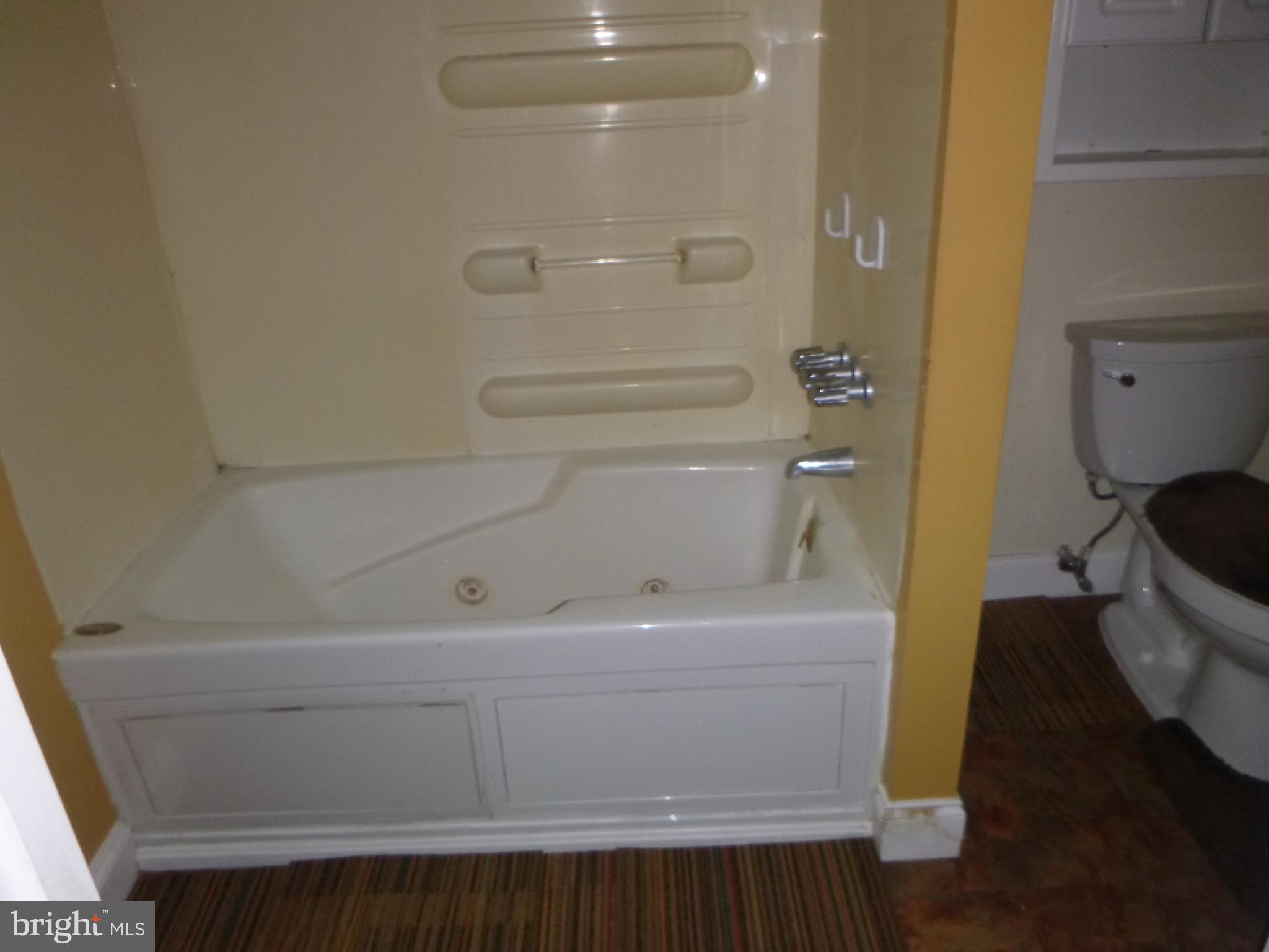 4669 Gadow Road Preston, MD 21655 - Photo 2 of 7 a bathroom with a sink a toilet and shower