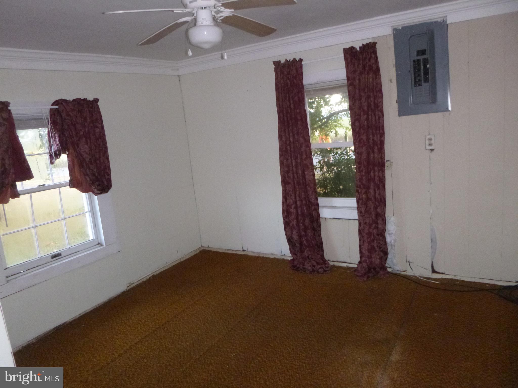 4669 Gadow Road Preston, MD 21655 - Photo 6 of 7 a view of an empty room with windows