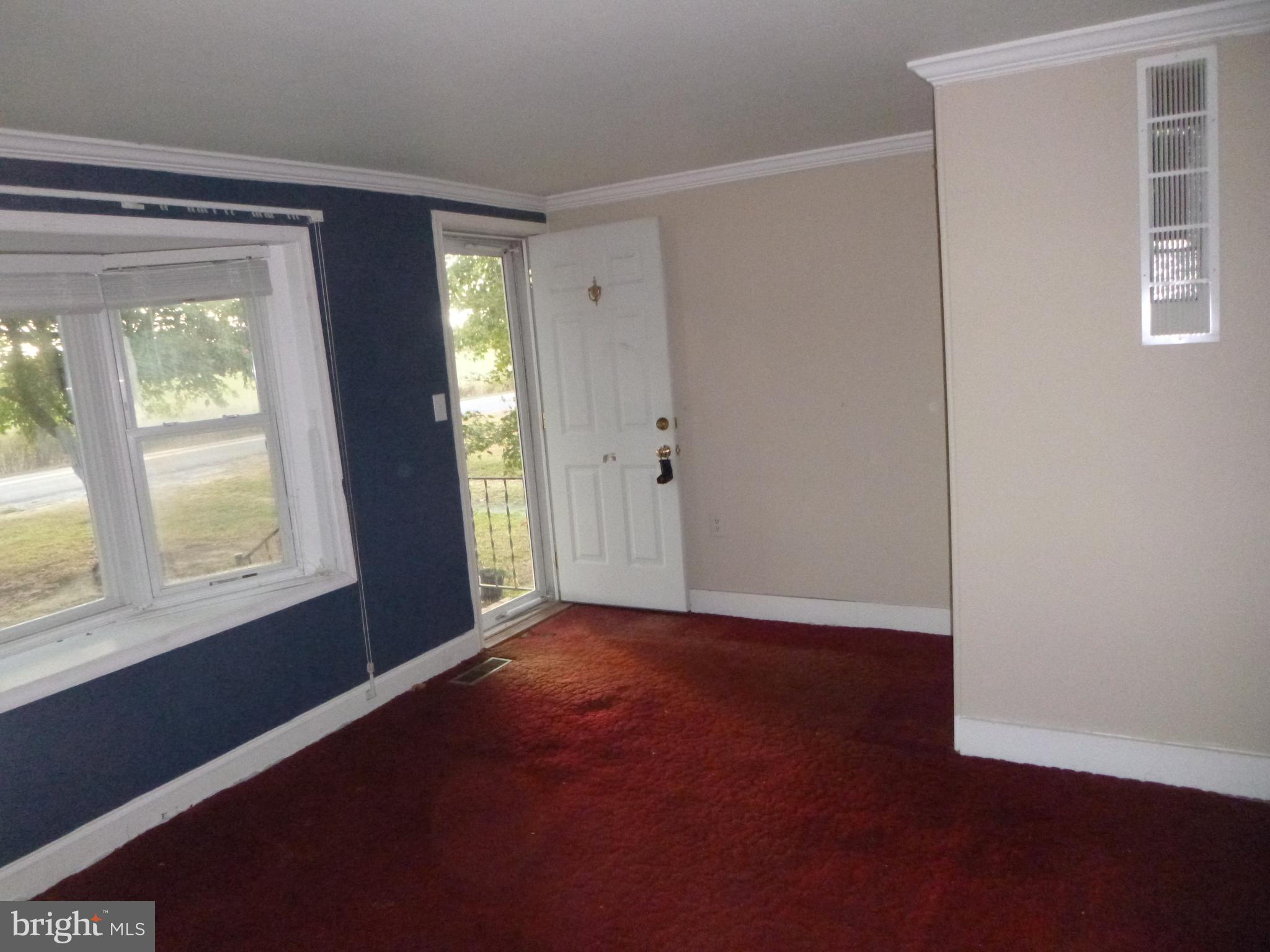 4669 Gadow Road Preston, MD 21655 - Photo 7 of 7 an empty room with windows and closet