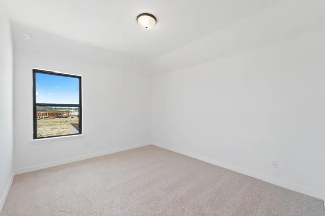 a bathroom with a sink double vanity granite tub shower and a mirror