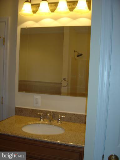 18002 Marshall Mill Road Hampstead, MD 21074 - Photo 12 of 30 a bathroom with a granite countertop sink and white