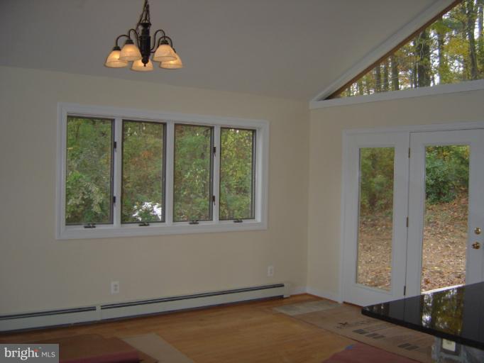 18002 Marshall Mill Road Hampstead, MD 21074 - Photo 3 of 30 an empty room with a window